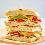 copycat Panera chipotle chicken avocado melt on parchment paper.