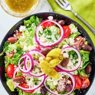 overhead view of copycat Panera Greek salad and dressing.