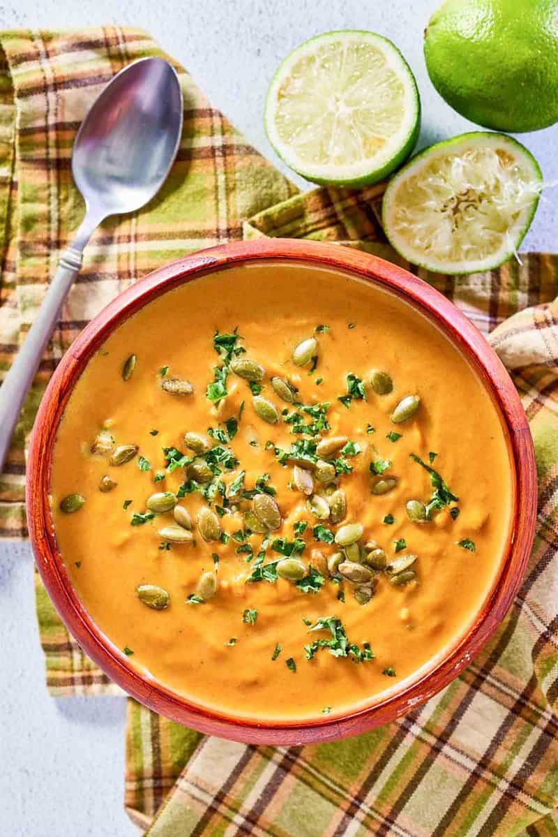 overhead view of pumpkin curry soup in a bowl.