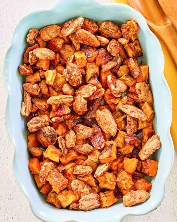 overhead view of roasted sweet potatoes with candied pecans.