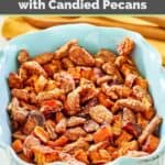honey roasted sweet potatoes topped with candied pecans in a dish.