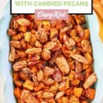 ovehead view of roasted sweet potatoes with pecans in a dish.