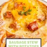 smoked sausage stew with potatoes and cheese in a bread bowl.