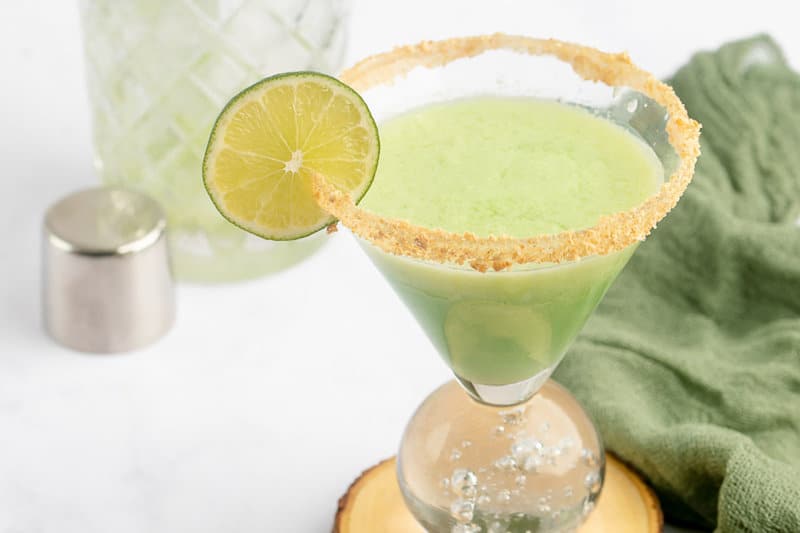 copycat Tommy Bahama key lime martini rimmed with graham cracker crumbs.