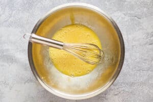 beaten eggs in a mixing bowl.