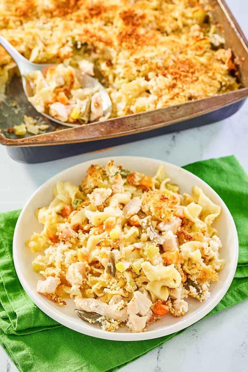 chicken noodle casserole on a plate and in a baking pan.