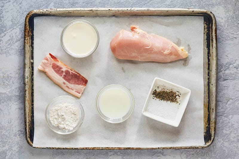 Cracker Barrel chicken fried chicken and sawmill gravy ingredients on a tray.