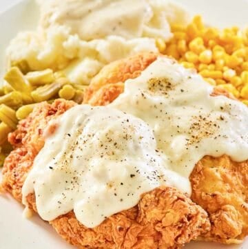 copycat Cracker Barrel chicken fried chicken with gravy on a plate.