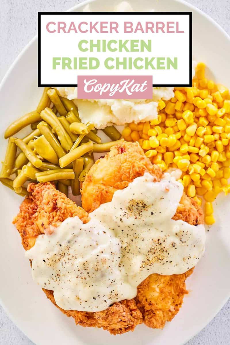 overhead view of homemade Cracker Barrel chicken fried chicken, gravy, and vegetables.