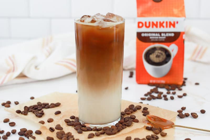 copycat Dunkin Donuts iced caramel macchiato drink and a bag of Dunkin coffee.