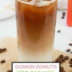 homemade Dunkin Donuts iced caramel macchiato and coffee beans.