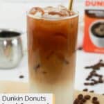 Homemade Dunkin iced caramel macchiato drink with a straw.