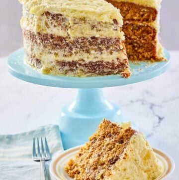 Hawaiian Cake on a blue cake stand and a slice on a plate.