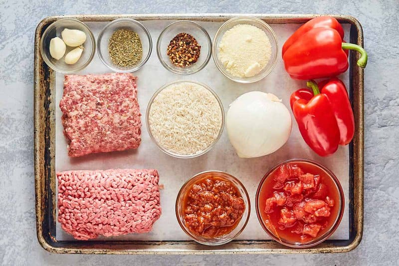 stuffed bell peppers ingredients on a tray.