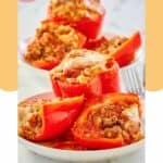 stuffed red bell peppers on plates.