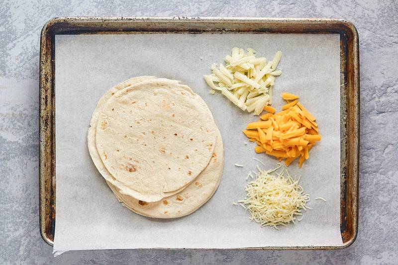 Taco Bell cheesy roll up ingredients on a tray.