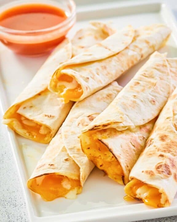 five copycat Taco Bell cheesy roll ups on a platter.