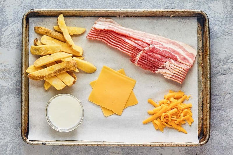 Wendy's Baconator fries ingredients on a tray.