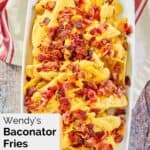 overhead view of homemade Wendy's baconator fries on a white platter.