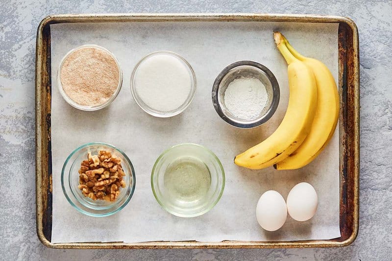whole wheat banana bread ingredients on a tray.