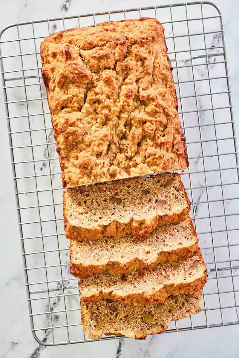 overhead view of whole wheat banana bread on a wire rack.