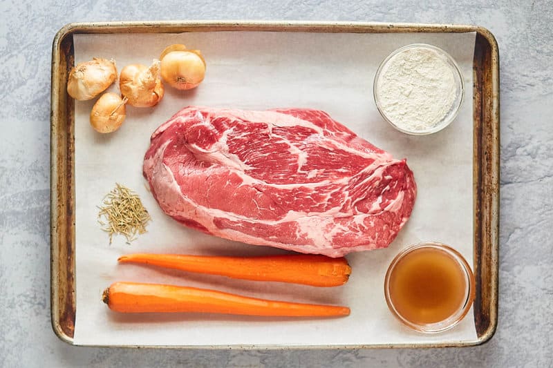 Yankee pot roast ingredients on a tray.