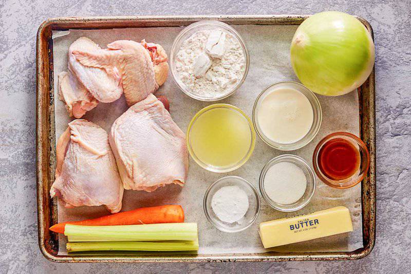 chicken and dumplings ingredients on a tray.