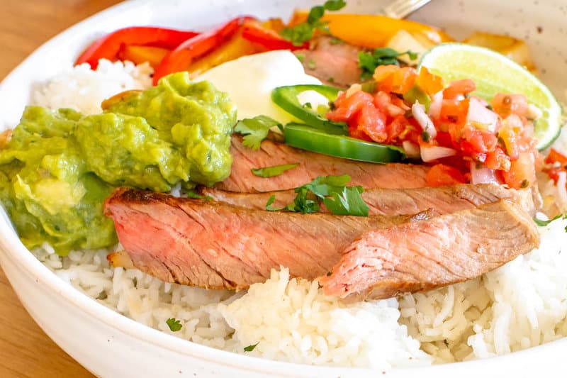 closeup of copycat Chipotle steak bowl with rice and veggies.