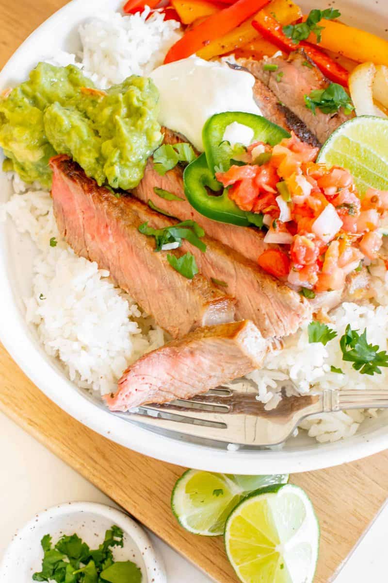 closeup of copycat Chipotle steak bowl with rice and veggies.