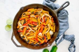 cooked vegetables in a skillet.