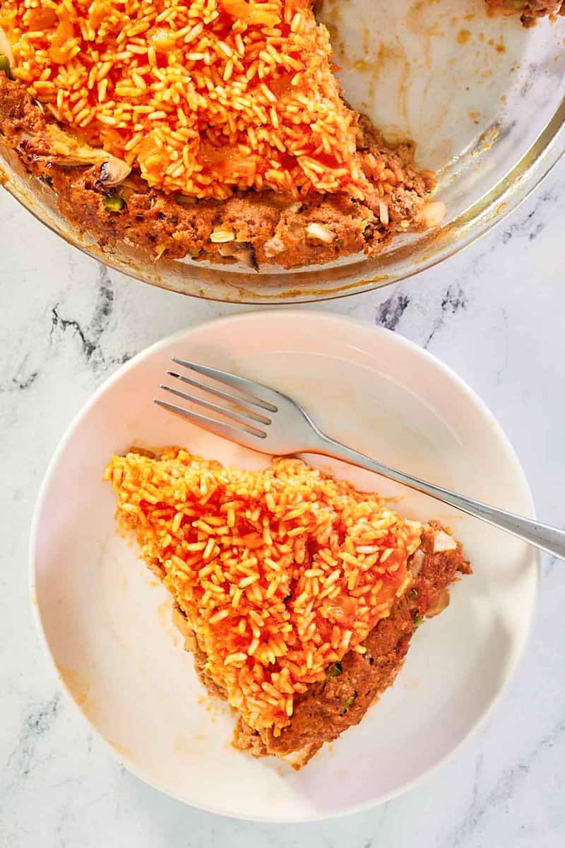 overhead view of country beef pie and a slice on a plate.