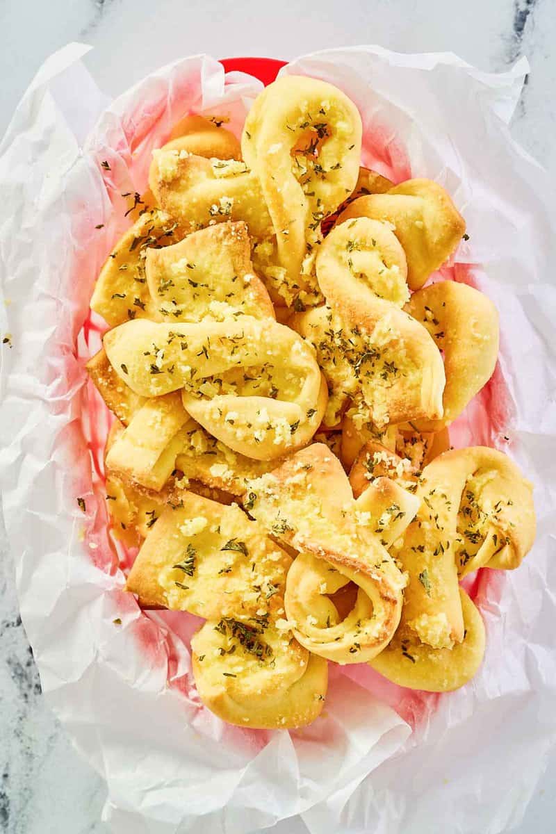 overhead view of copycat Domino's garlic bread twists in a basket.