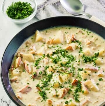 clam chowder in a black bowl.