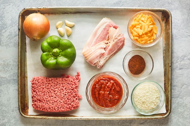 Mexican rice casserole ingredients on a tray.