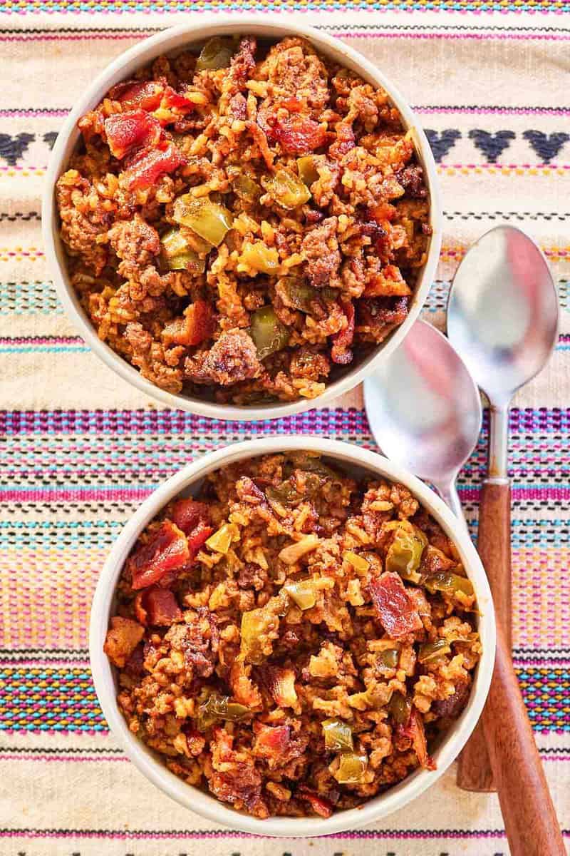 overhead view of Mexican rice casserole in two bowls.