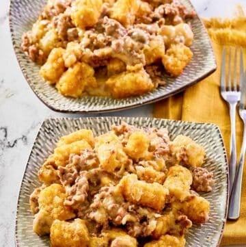 Mexican tater tot casserole on two plates.