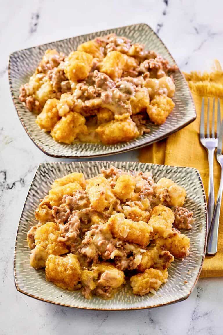 Mexican tater tot casserole on two plates.