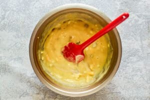 Mexican tater tot cheese and soup mixture in a bowl.