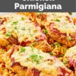 homemade Olive Garden chicken parmigiana over pasta with sauce.