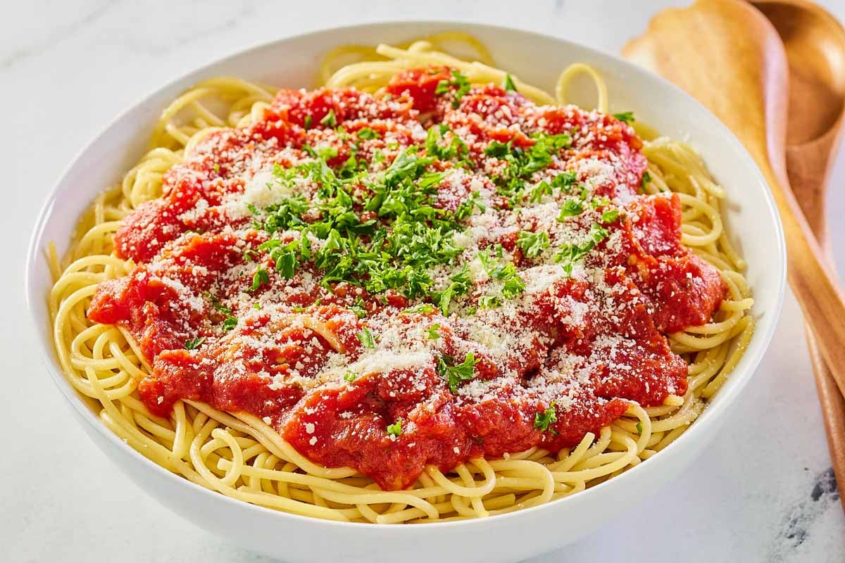 copycat Olive Garden Marinara sauce over spaghetti in a bowl.