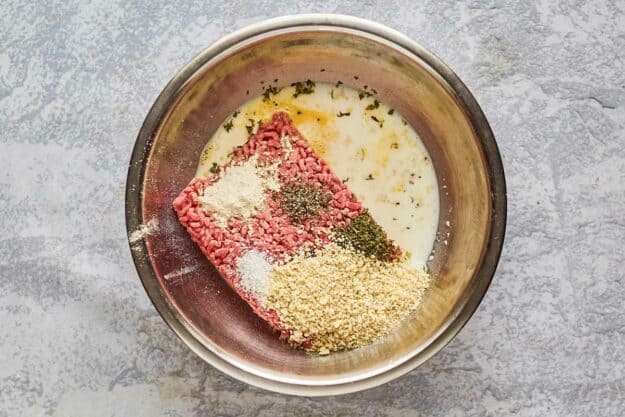 Olive Garden meatballs ingredients in a mixing bowl.