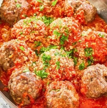 copycat Olive Garden meatballs and marinara in a skillet.