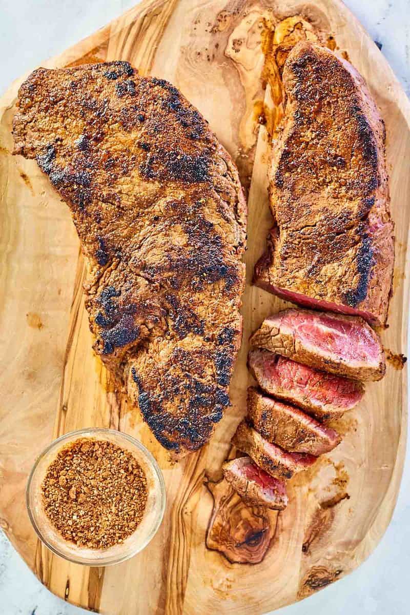 overhead view of copycat Outback steak seasoning and two steaks.