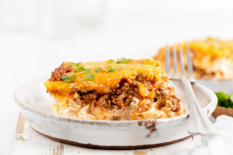 sour cream noodle bake and a fork on a plate.