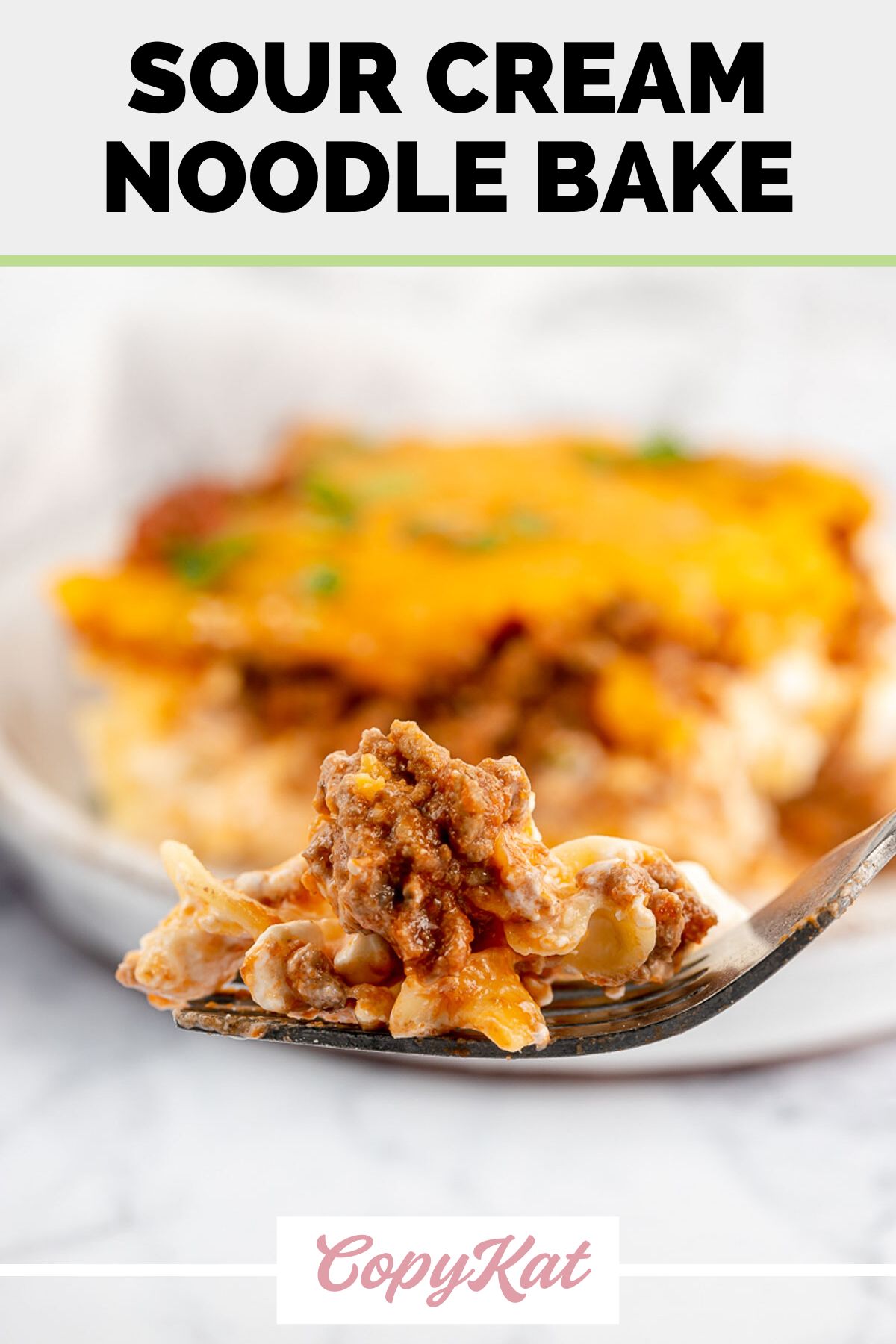 sour cream noodle bake on a fork.