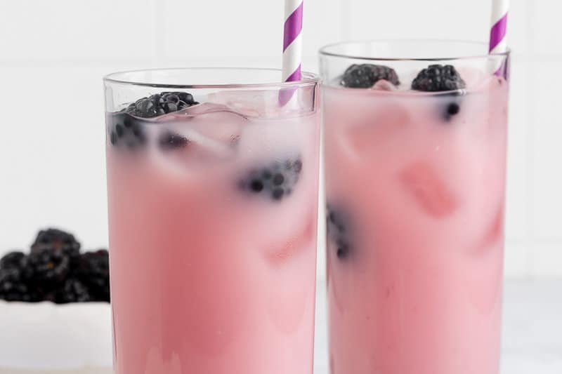 copycat Starbucks violet drink garnished with blackberries.
