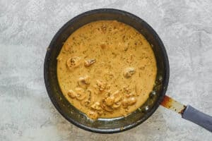 steak marsala sauce in a skillet.