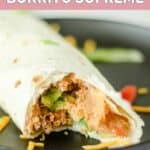 copycat Taco Bell burrito supreme with a bite out of it.