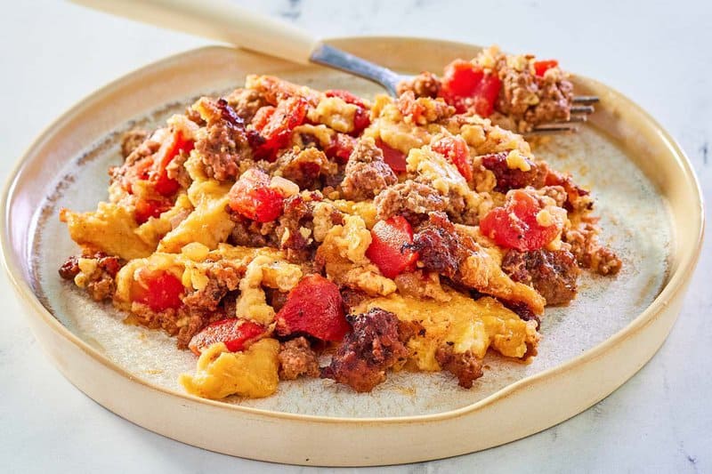 beef tamale casserole and a fork on a plate.