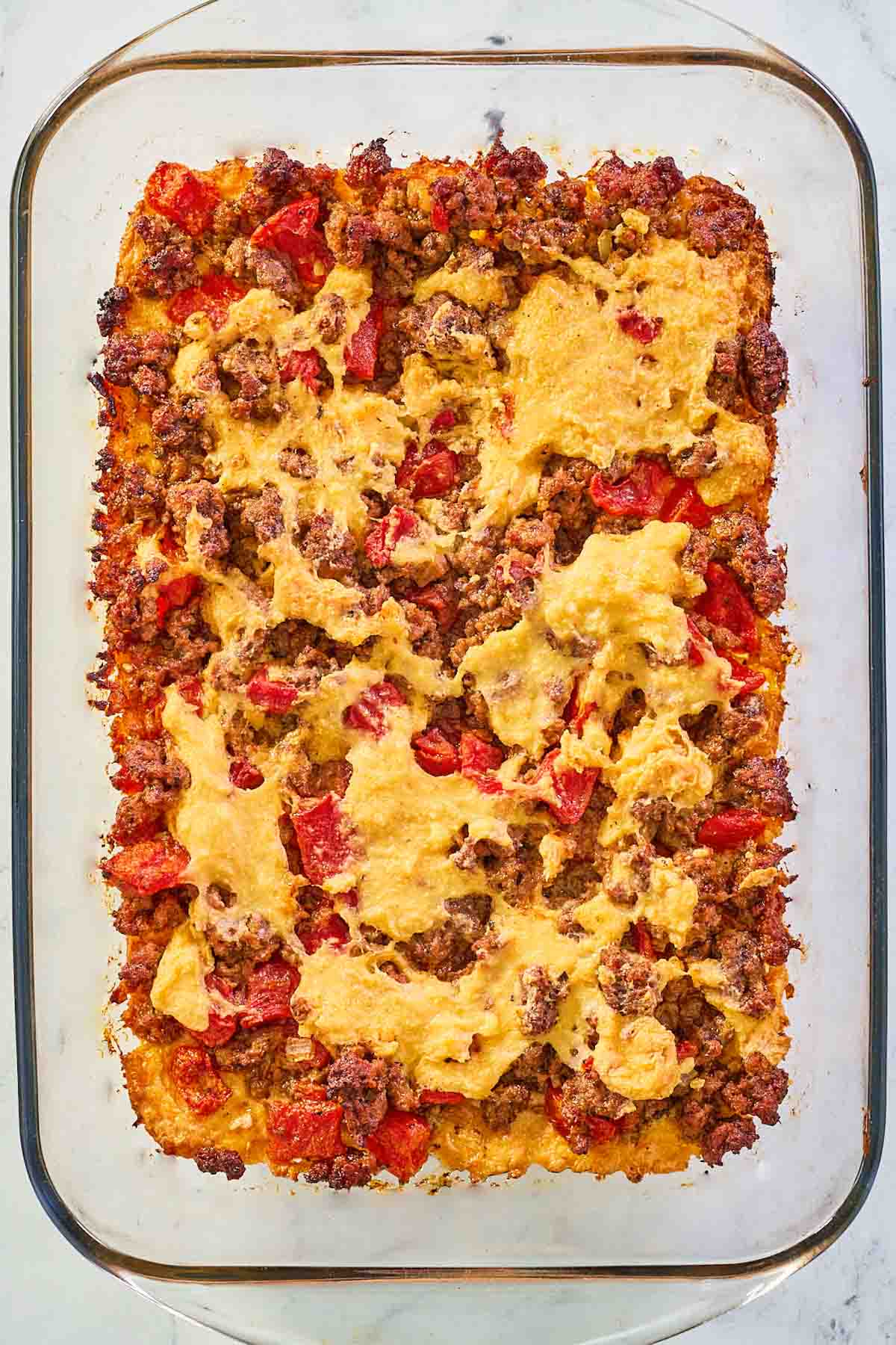 beef tamale casserole in a glass baking dish.